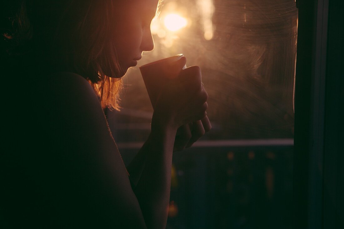 woman holding hot drink